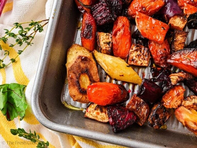 Overhead shot of a corner of a sheet pan with roasted root veggies.