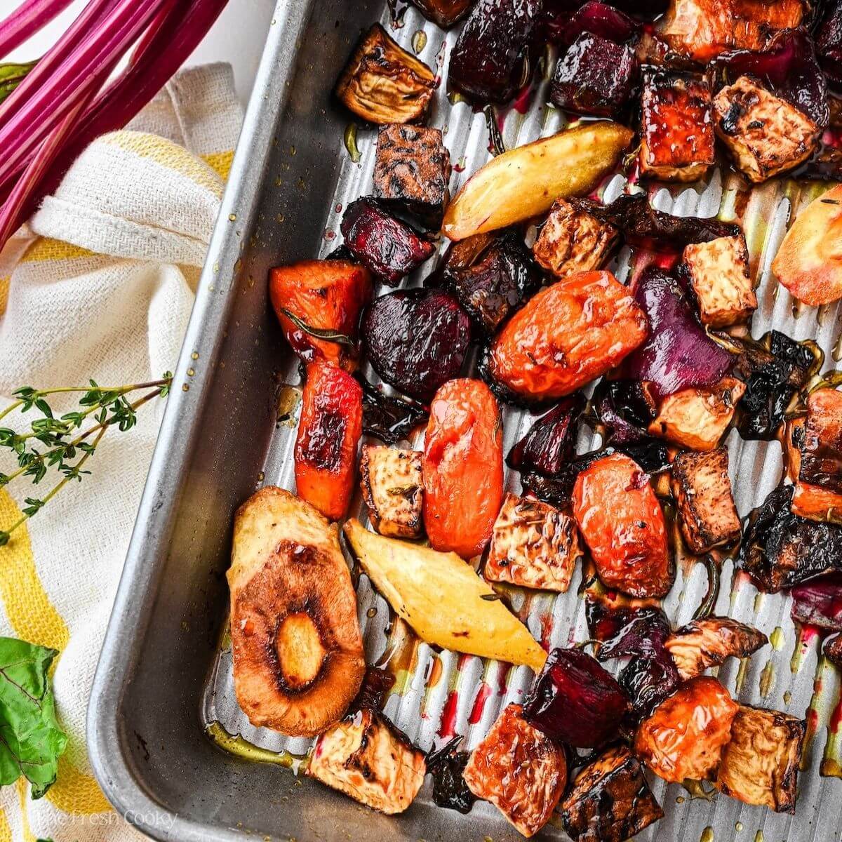 Roasted root vegetables, caramelized on a sheet pan, with honey glaze.
