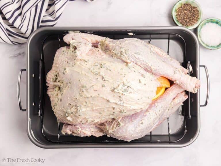 Herb butter turkey with the compound butter spread on top.