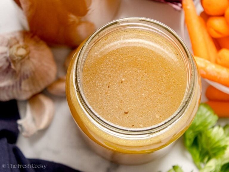 Top of a jar full of homemade chicken stock.