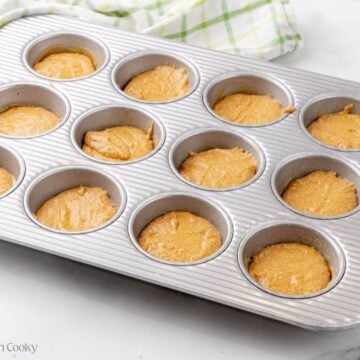 Honey bran muffin batter in the muffin tin.