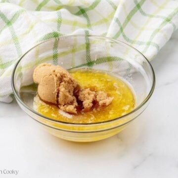 Brown sugar and melted butter in a bowl.