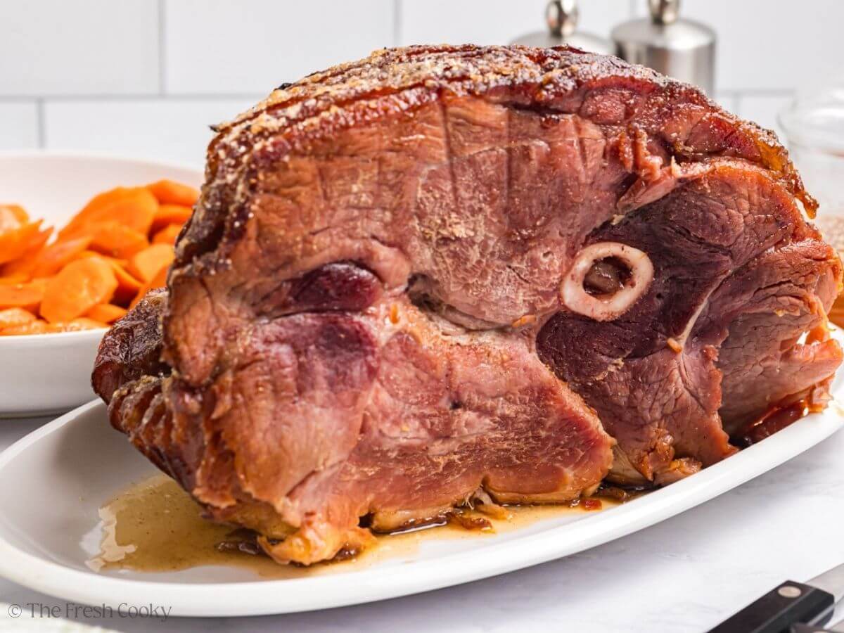 Whole spiral sliced ham topped with a honey butter sugar glaze.