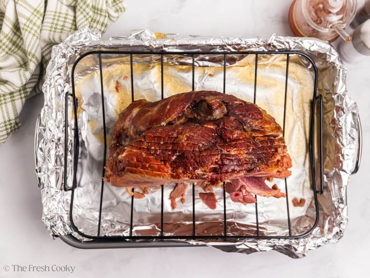Ham in roaster with rack, ready for final glaze.