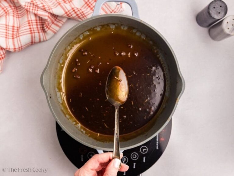 Spoon coated with maple glaze to show that it is ready.