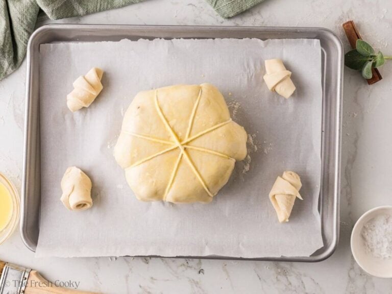 Pumpkin baked brie baked to deep golden brown on a sheet pan.