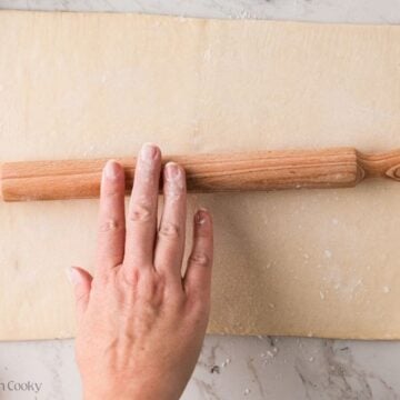 Lightly roll the puff pastry dough into a 10-12 inch square or rectangle.