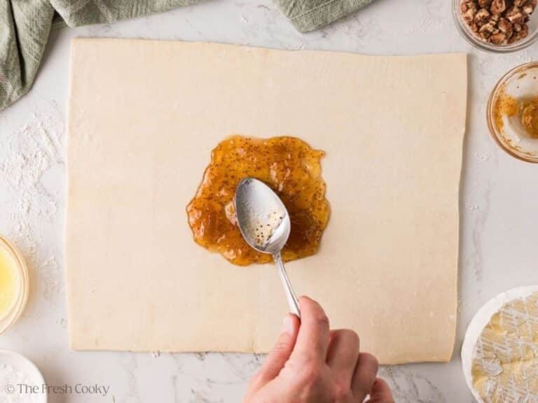 Fig jam spread in a circle on puff pastry