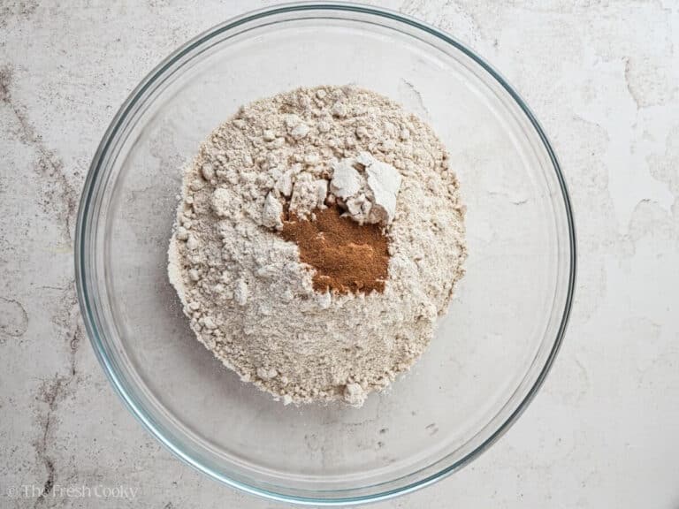 Spice cake mix with pumpkin pie spice in a bowl.
