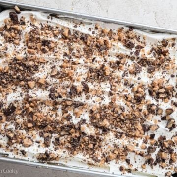 Toffee bits sprinkled on top of the pumpkin poke cake.