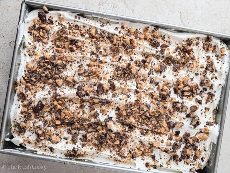 Toffee bits sprinkled on top of the pumpkin poke cake.