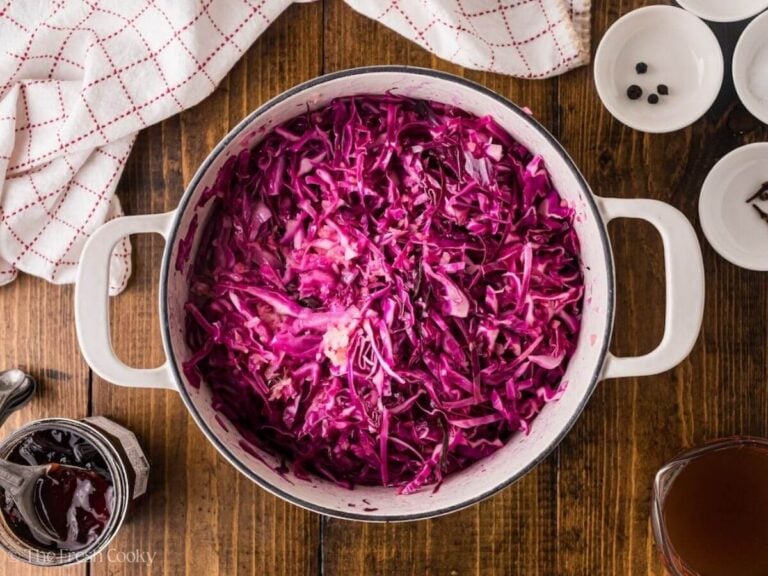 Red cabbage added to the pot of apples and onions.