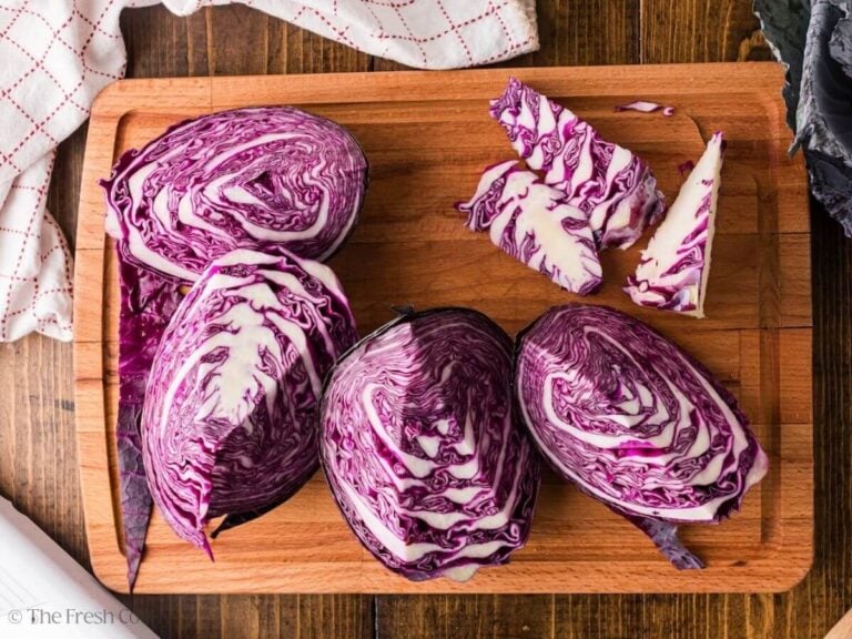 Red cabbage cut into four quarters.