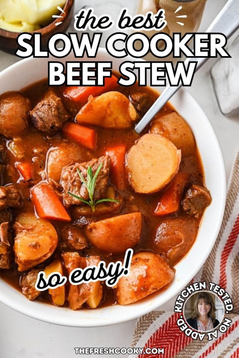 Close up of the beef stew in a white bowl, with tender beef cubes, potatoes, carrots in a rich wine gravy, for pinning.