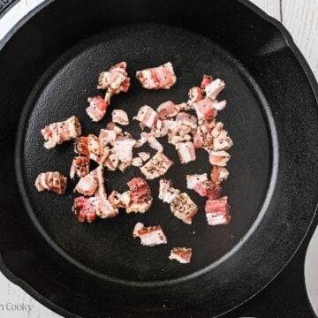 Bacon pieces in a pan ready to cook.