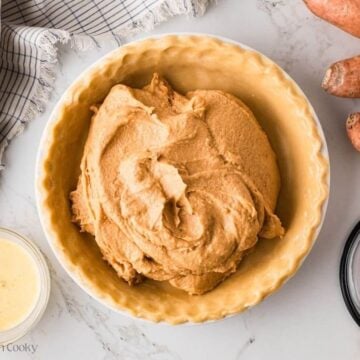Sweet potato pie filling placed in the pie crust.