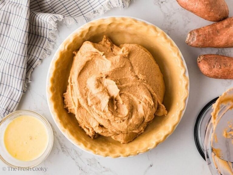 Sweet potato pie filling placed in the pie crust.