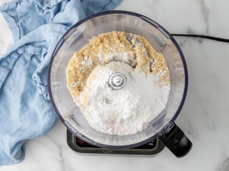 Almond flour and sugar in a food processor.