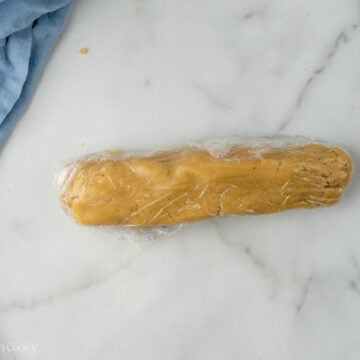 Almond paste wrapped in plastic wrap.