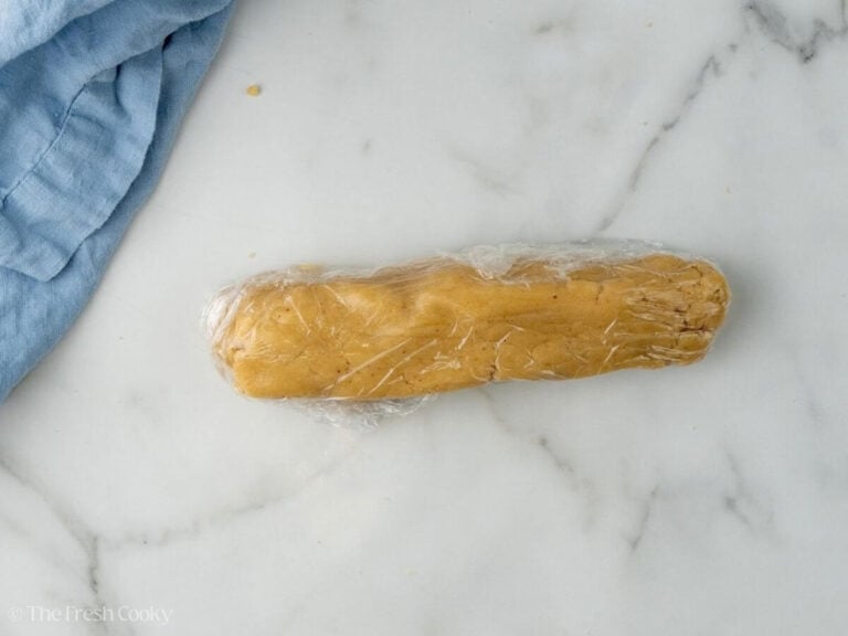 Almond paste wrapped in plastic wrap.