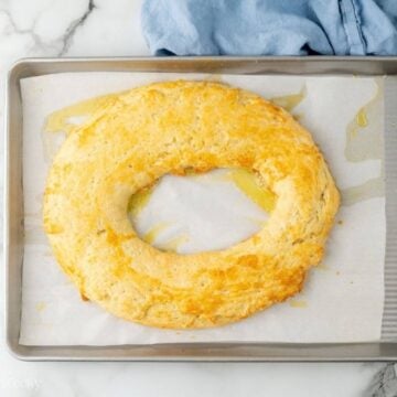 Baked almond kringle on a sheet pan.