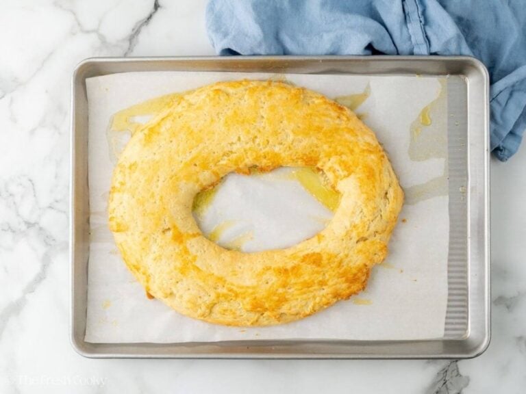 Baked almond kringle on a sheet pan.