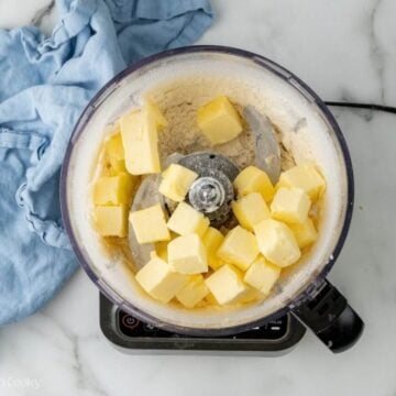 Cold butter added to flour in a food processor.