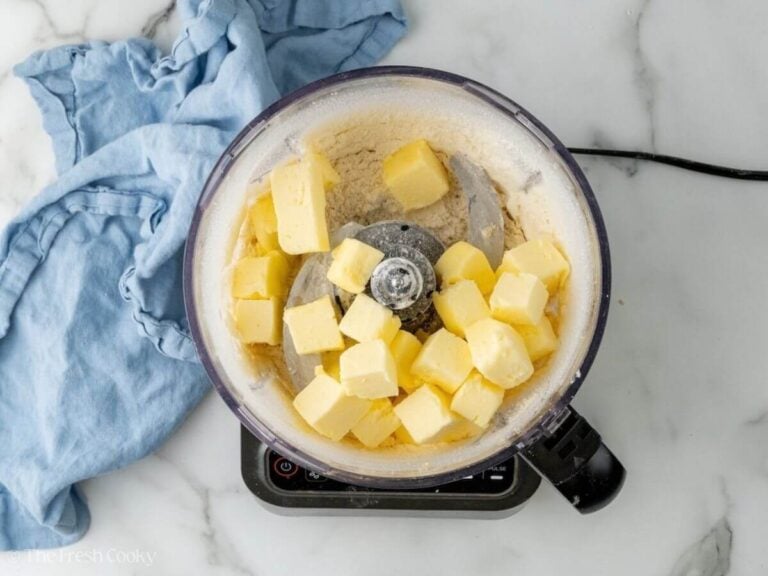 Cold butter added to flour in a food processor.