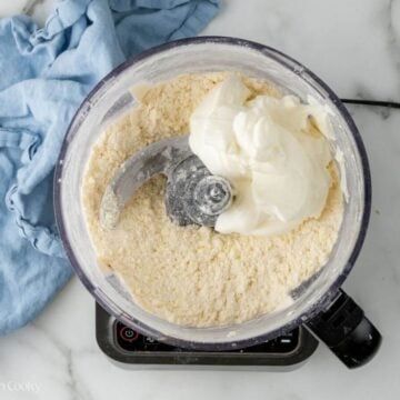 Sour cream added to the butter and flour in a food processor.
