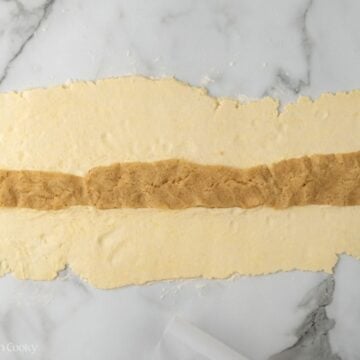 Almond paste added in strip down the middle of the pastry dough.