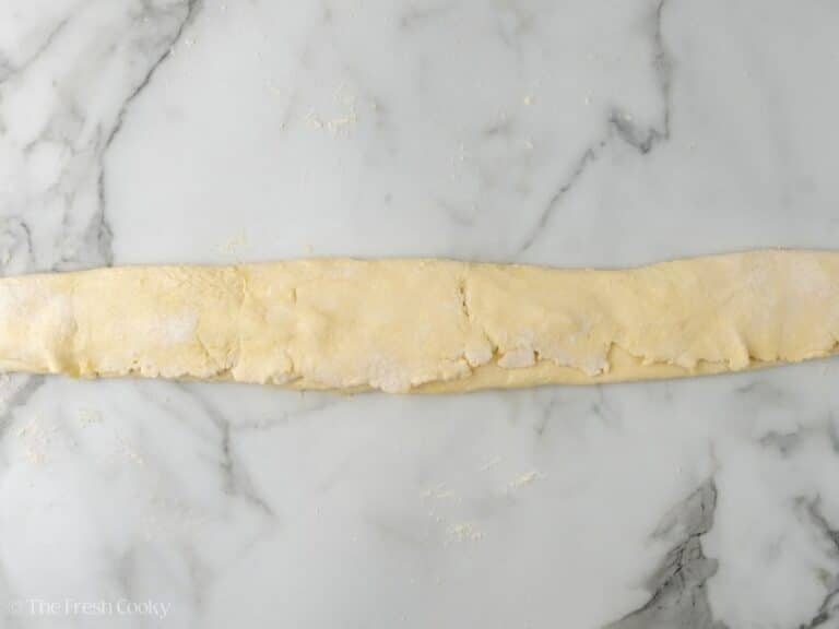 Other half of pastry dough now covering the almond paste.