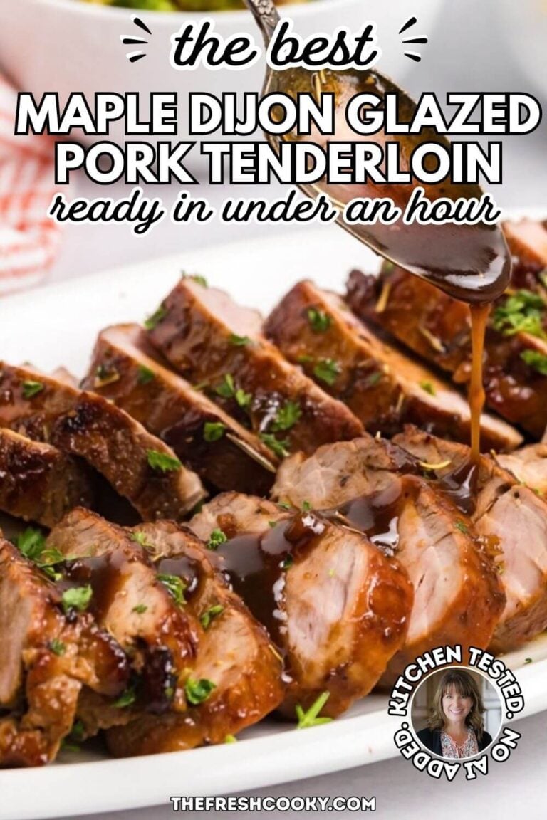 Spoon drizzling a thick maple dijon apple glaze over sliced perfectly juice pork tenderloin, to pin.