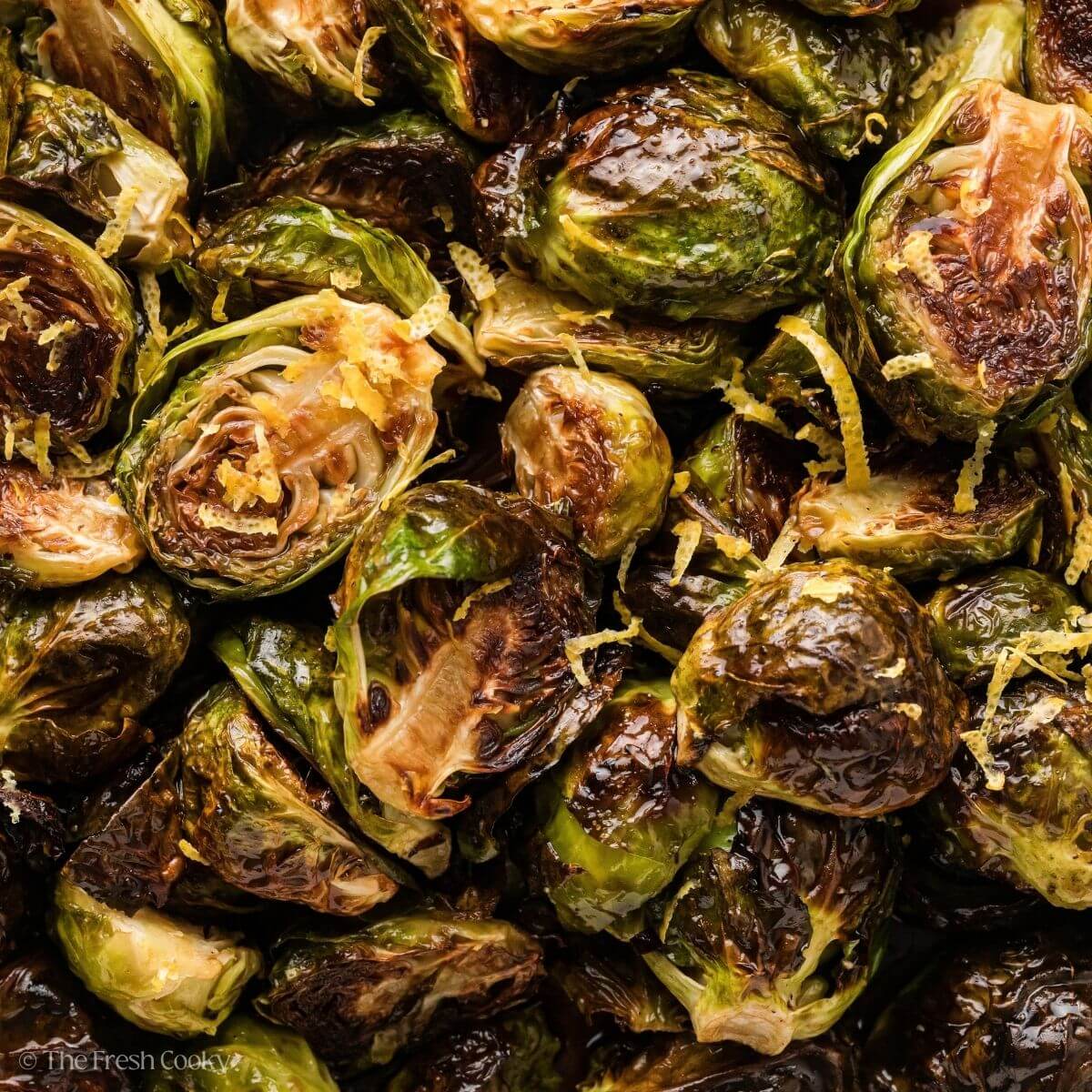 Close up of roasted Brussels sprouts with a honey balsamic glaze.